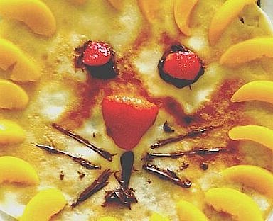 Pfannkuchen verziert als Löwenkopf